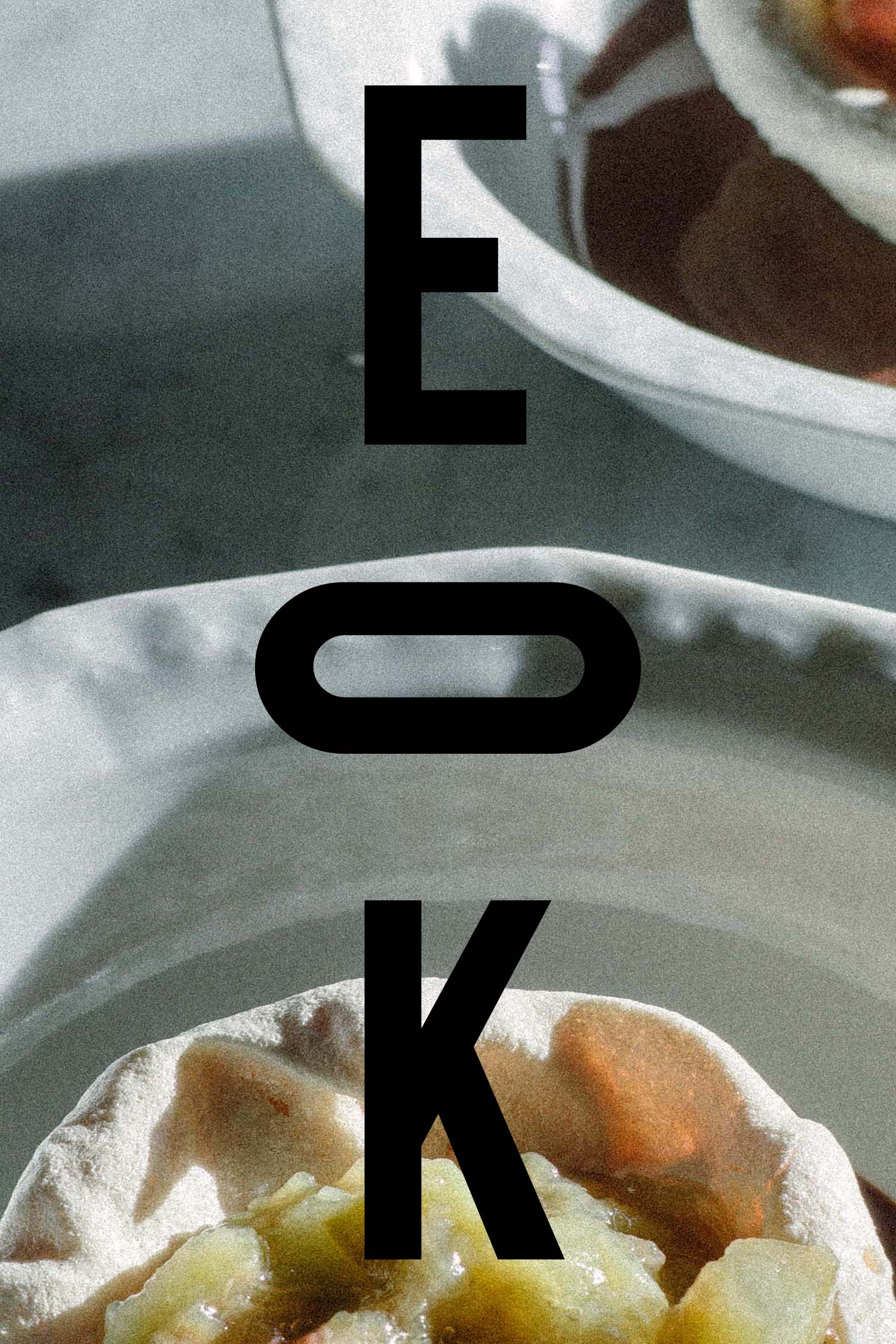 East of Kitchen lettering over a close-up of food on a plate