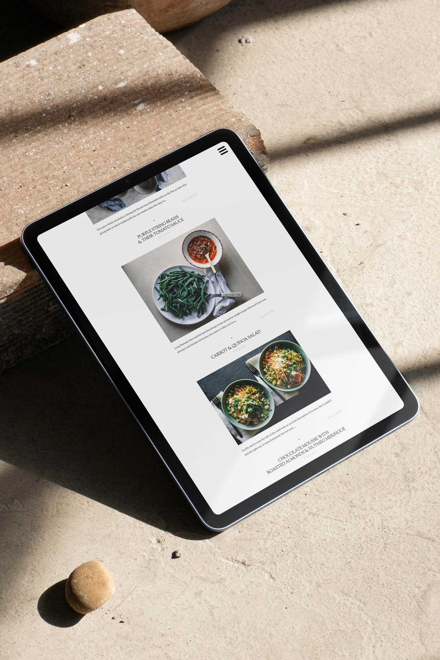 Tablet displaying recipe cards on a sunlit floor