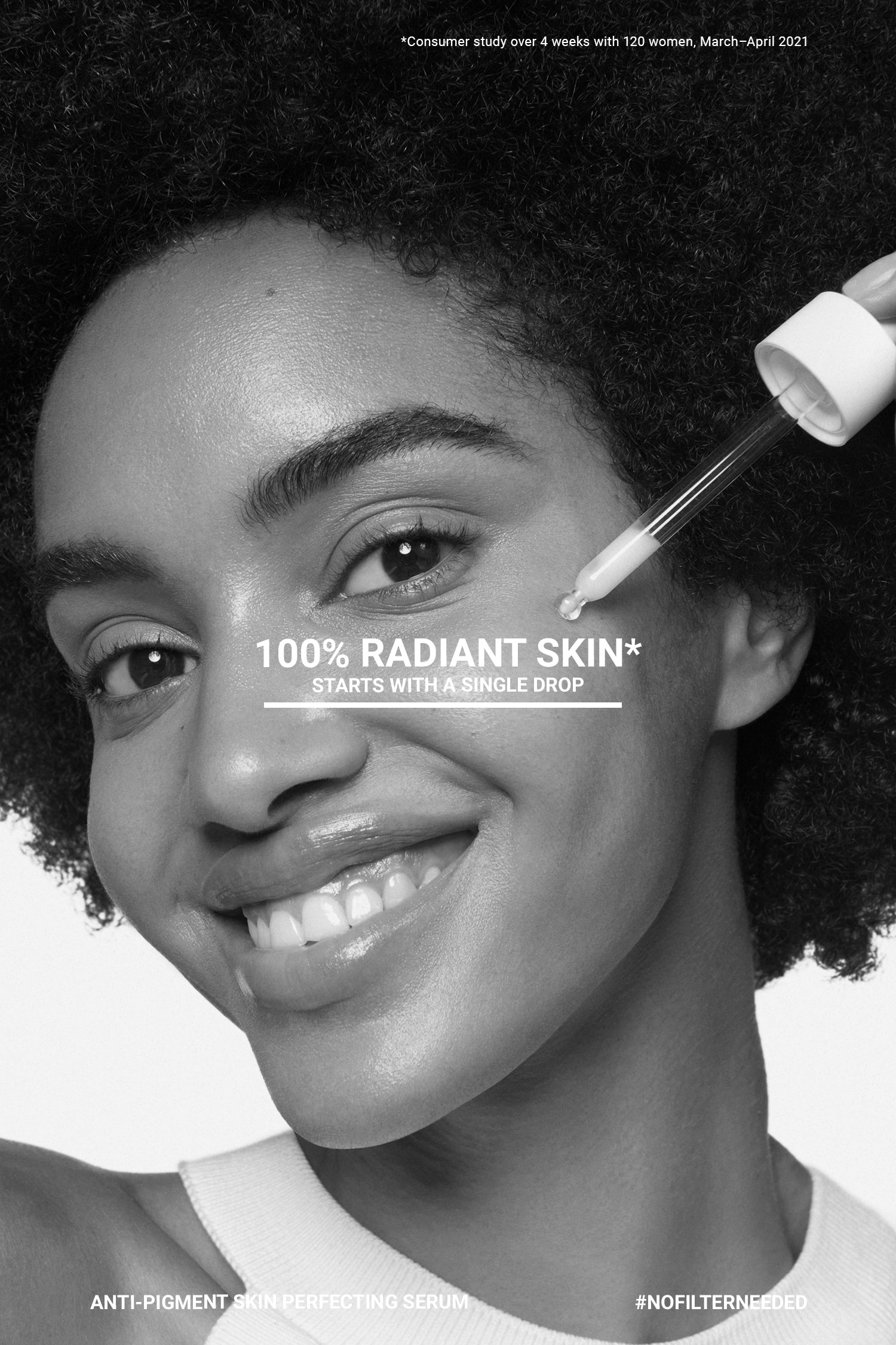 Black-and-white close-up of a smiling woman with serum dropper by her cheek