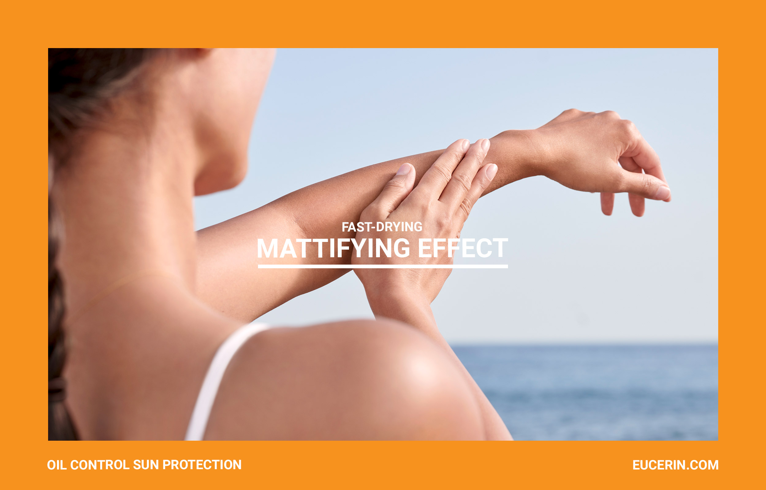 Woman’s sunlit shoulder and arm in an orange Eucerin mattifying-effect frame