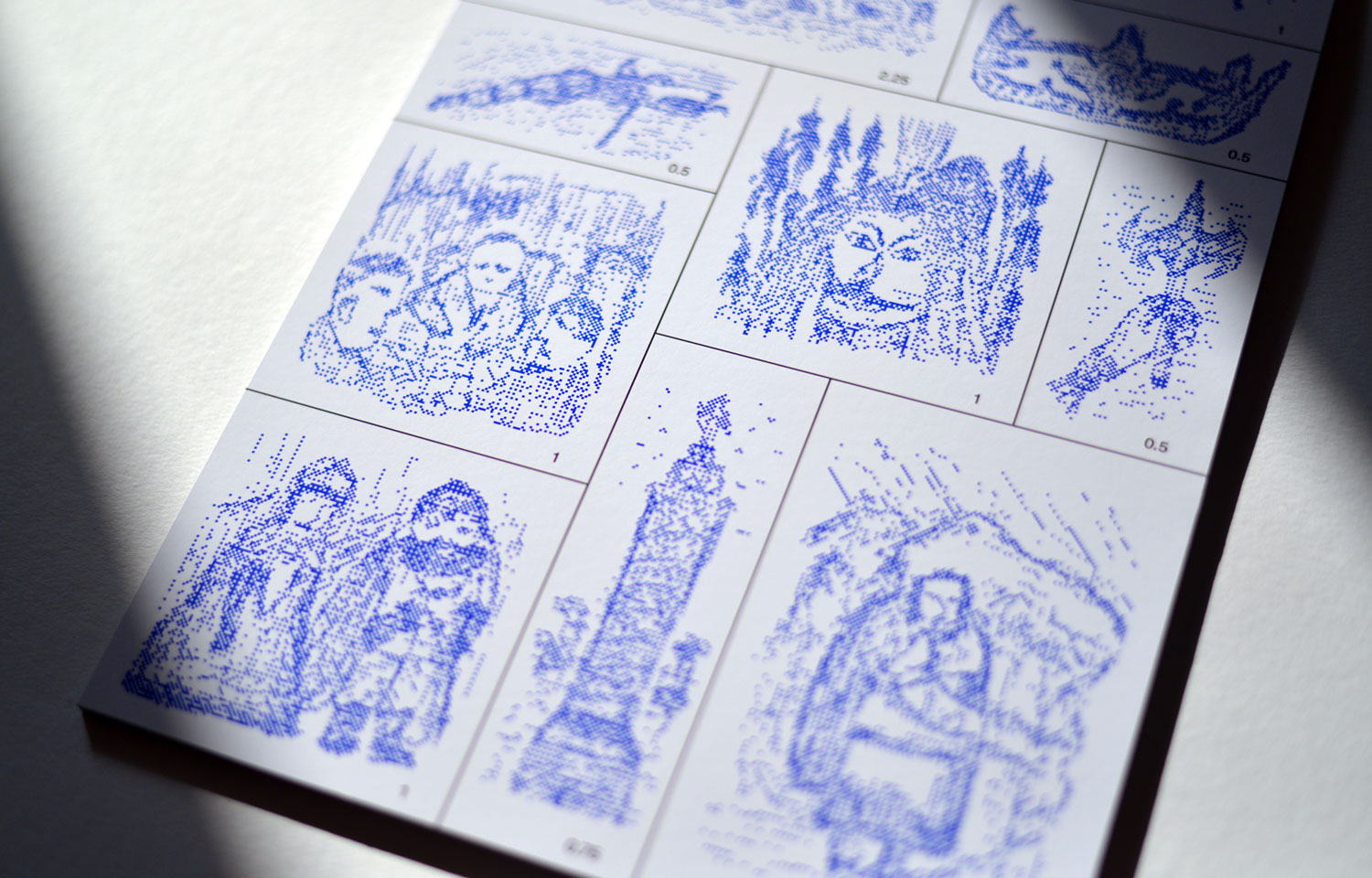 Close-up of blue dotted animal and figure illustrations in square panels