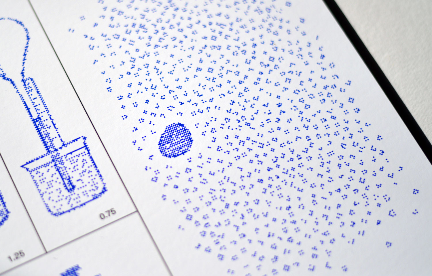 Close-up of dense blue dotted texture beside a small object diagram