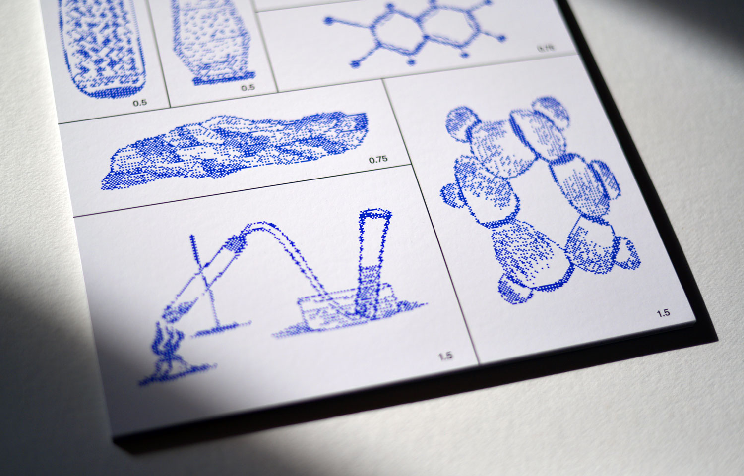 Close-up of blue dotted boat, tools and clustered organic form drawings