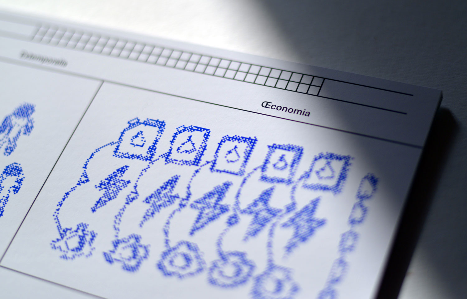 Close-up of a blue dotted row of small figures and symbols