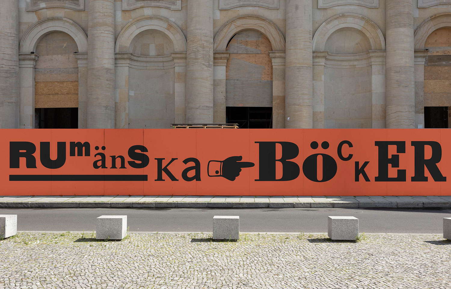 Romanian Book Fair signage outside a stone building