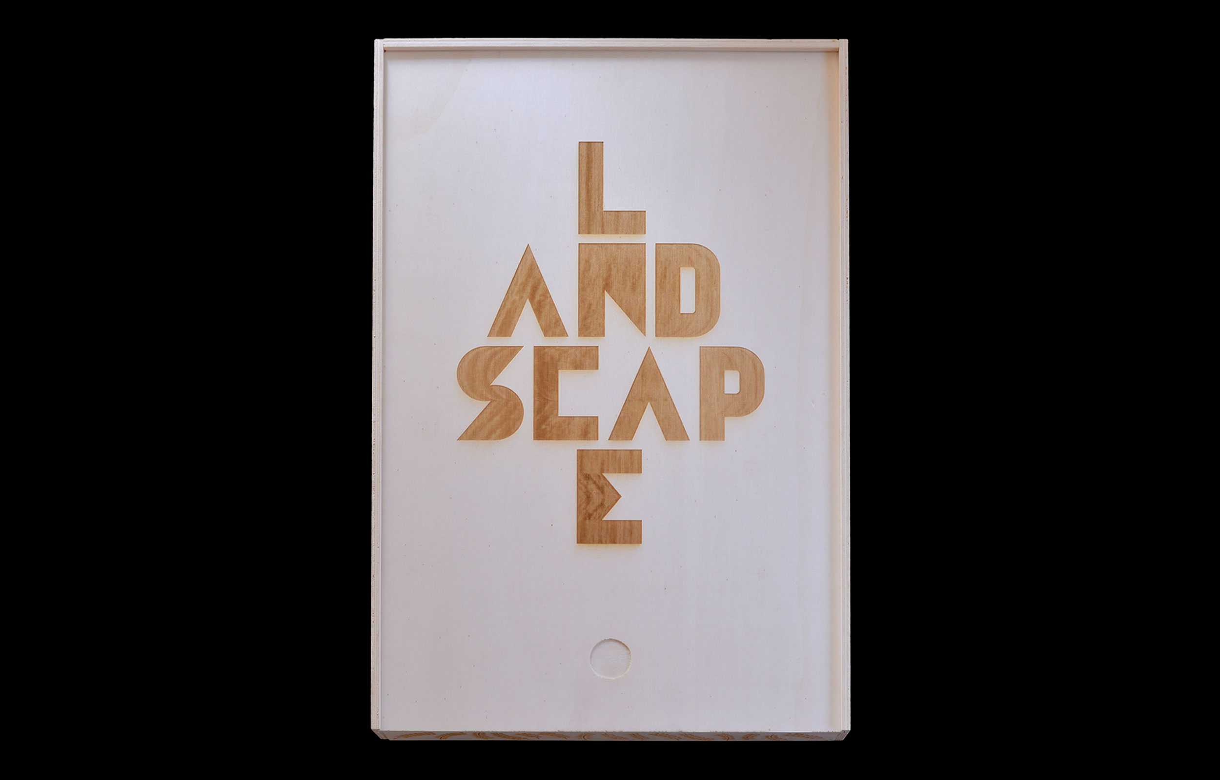 White card with the word LANDSCAPE in angular gold lettering