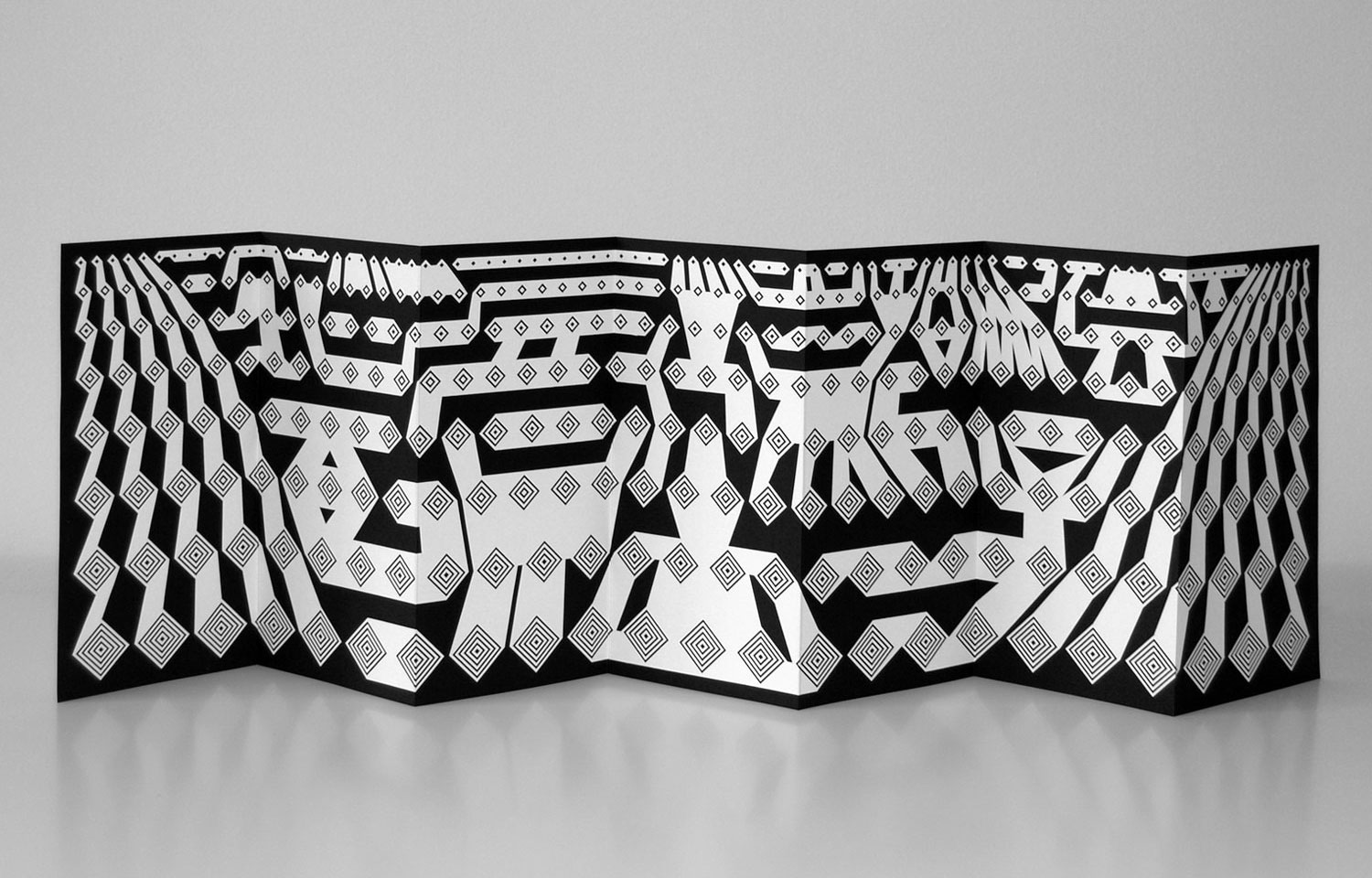 Black-and-white patterned folded paper sculpture