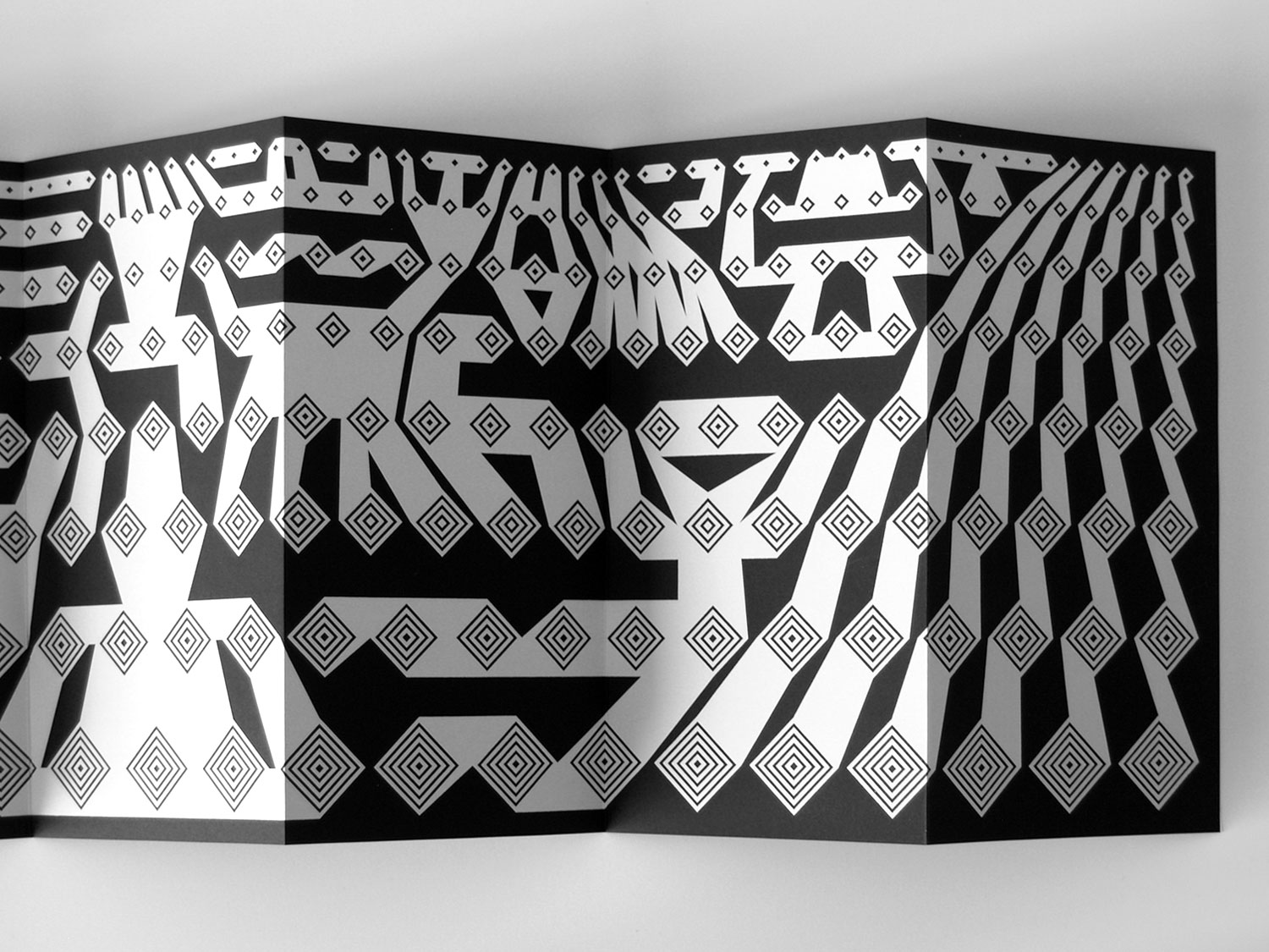 Close-up of a black-and-white geometric banner with diamond patterning