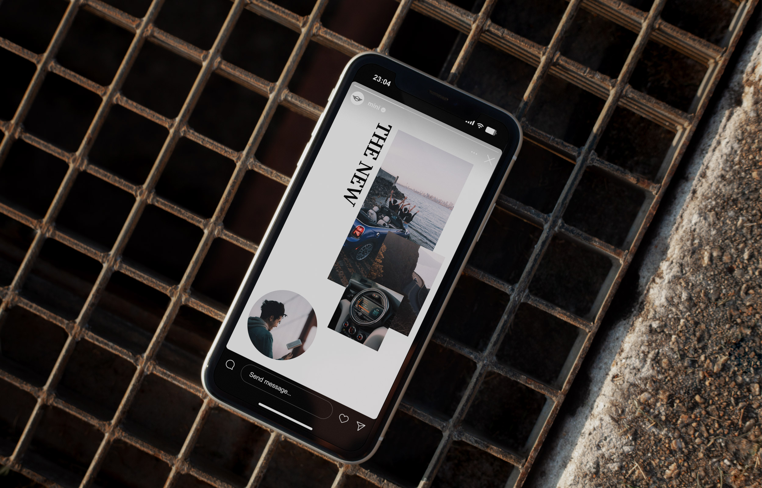 Smartphone displaying a Mini webpage on a rusty metal grate