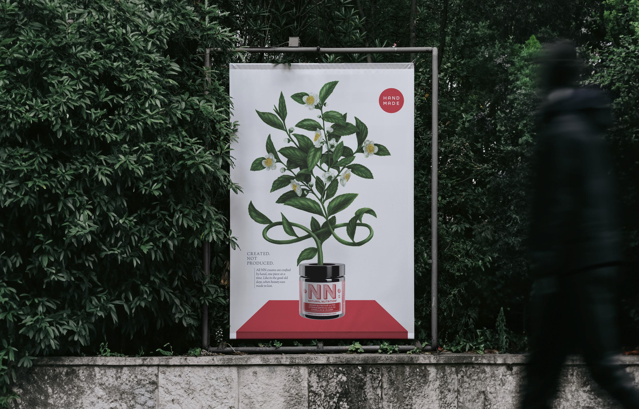 Outdoor billboard showing a leafy plant growing from an NN jar