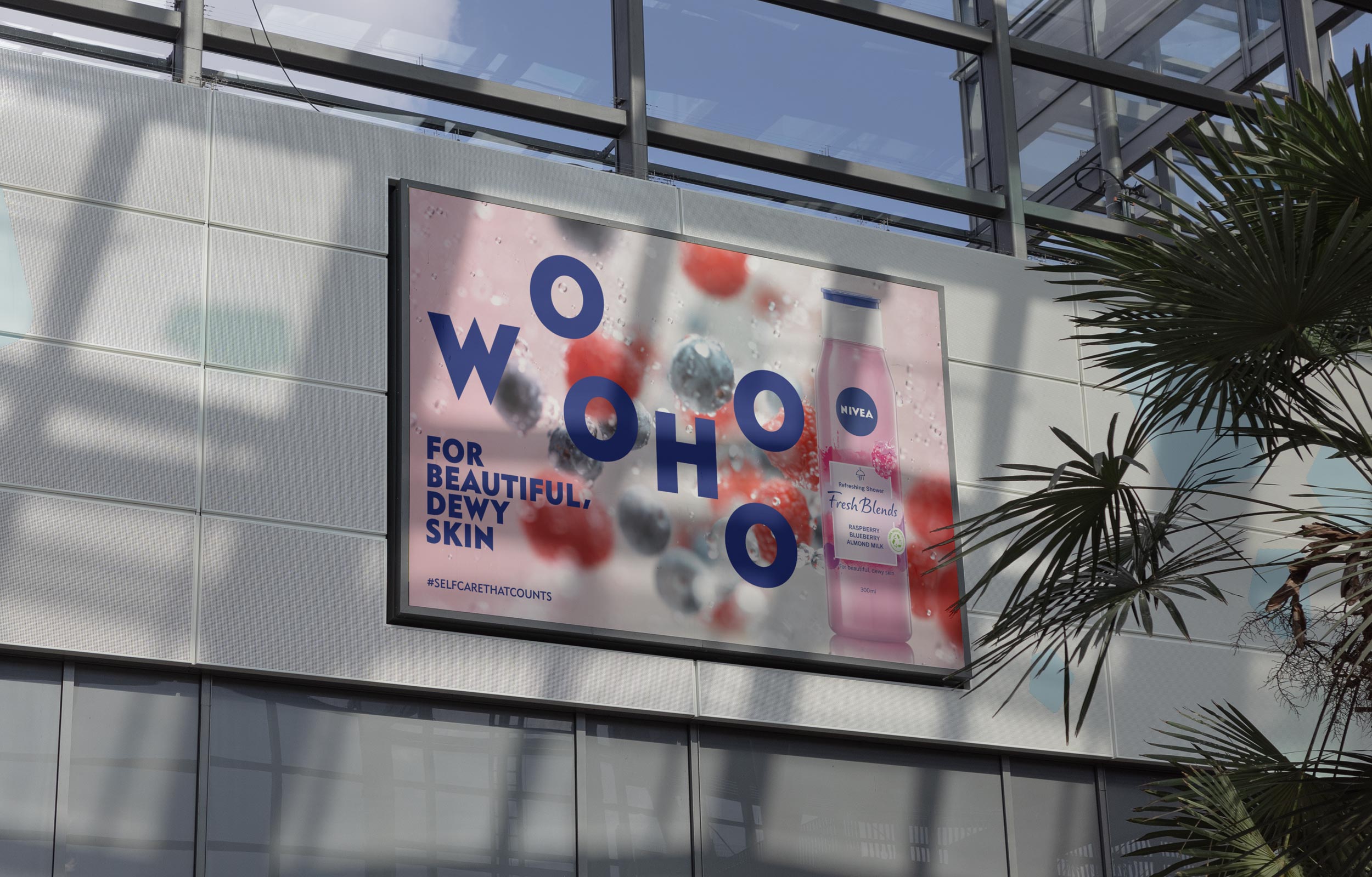 Nivea berry campaign billboard in a bright indoor atrium
