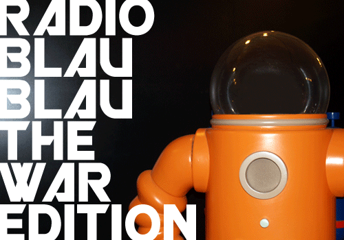 Orange toy robot beside stacked white Radio Blau Blau The War Edition lettering