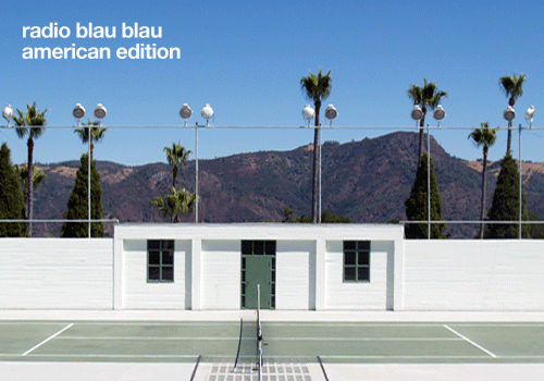 White building beside a tennis court with Radio Blau Blau American Edition text