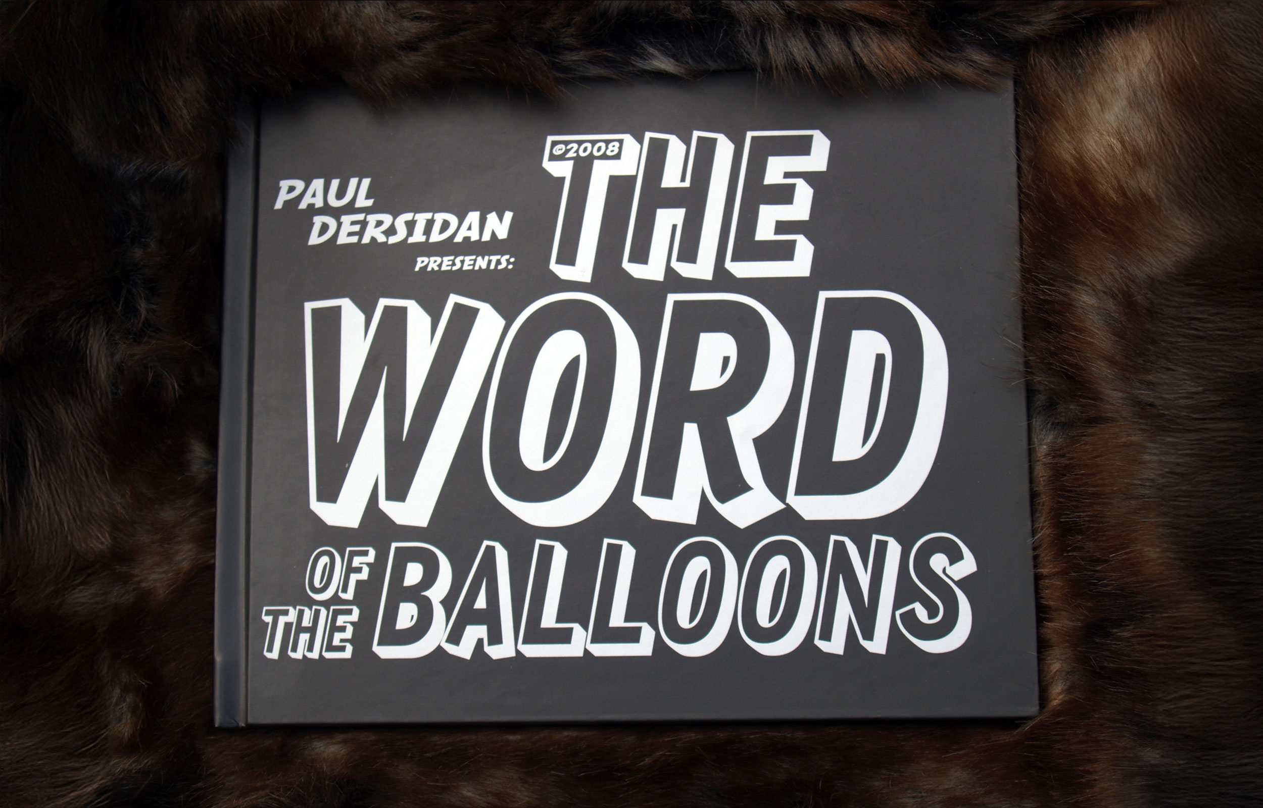 Book cover reading The Word of the Balloons in white outlined lettering